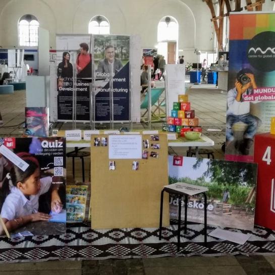 MUNDU stand with leaflets and marketing materials